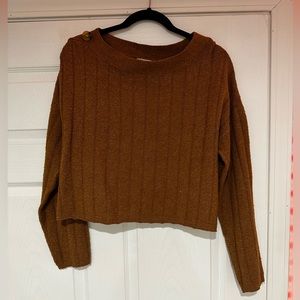 a brown sweater